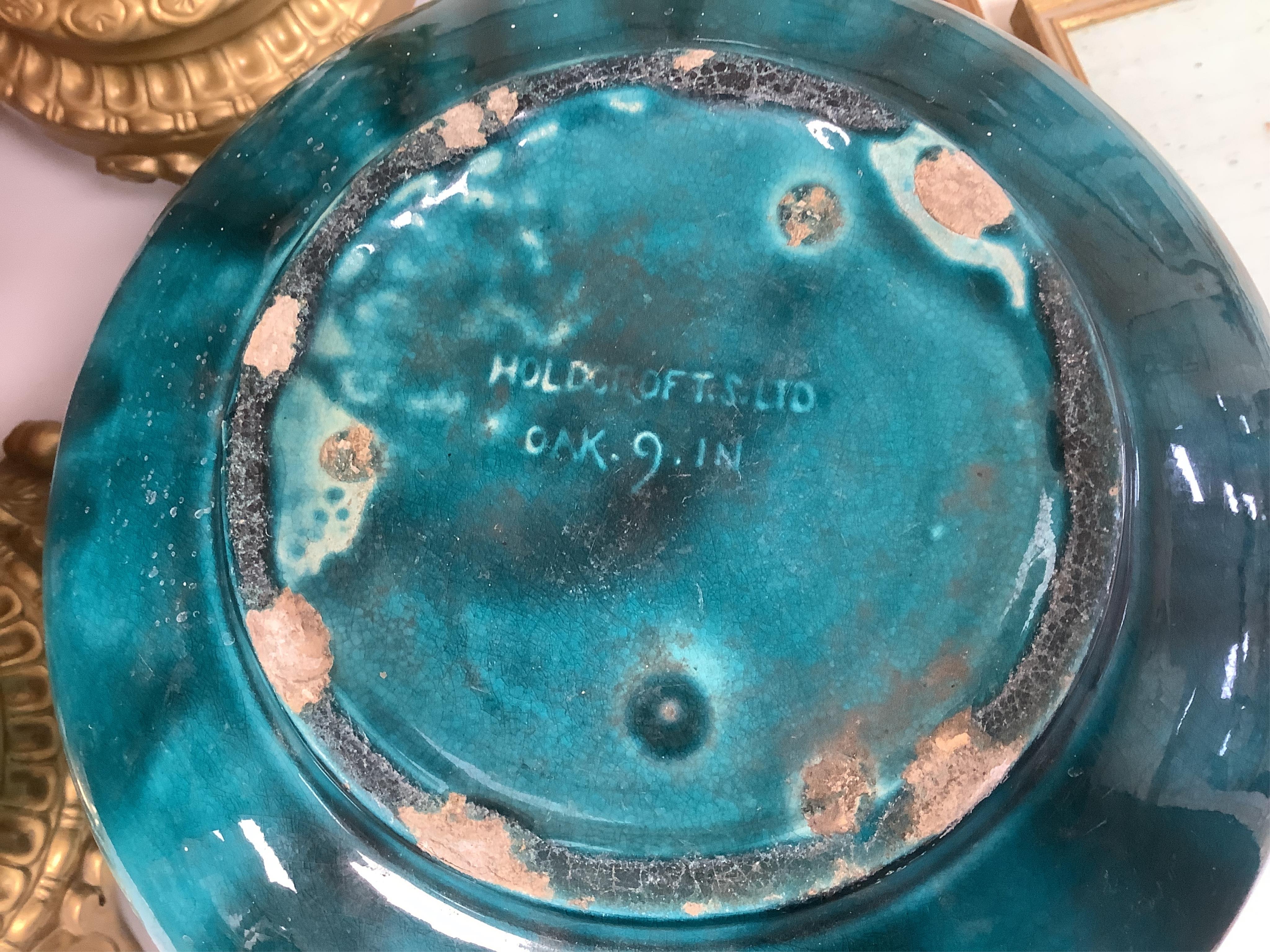 A Burmantofts style turquoise glazed jardiniere and a similar larger stand, decorated in relief, 90cm high